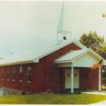 This picture was taken in the 1980's.  In 1962 the church moved about two blocks north of Elston, after trading for a two-acre tract and erected the present building.  A 28’ X 54’ brick veneer structure with facilities in the basement was erected.